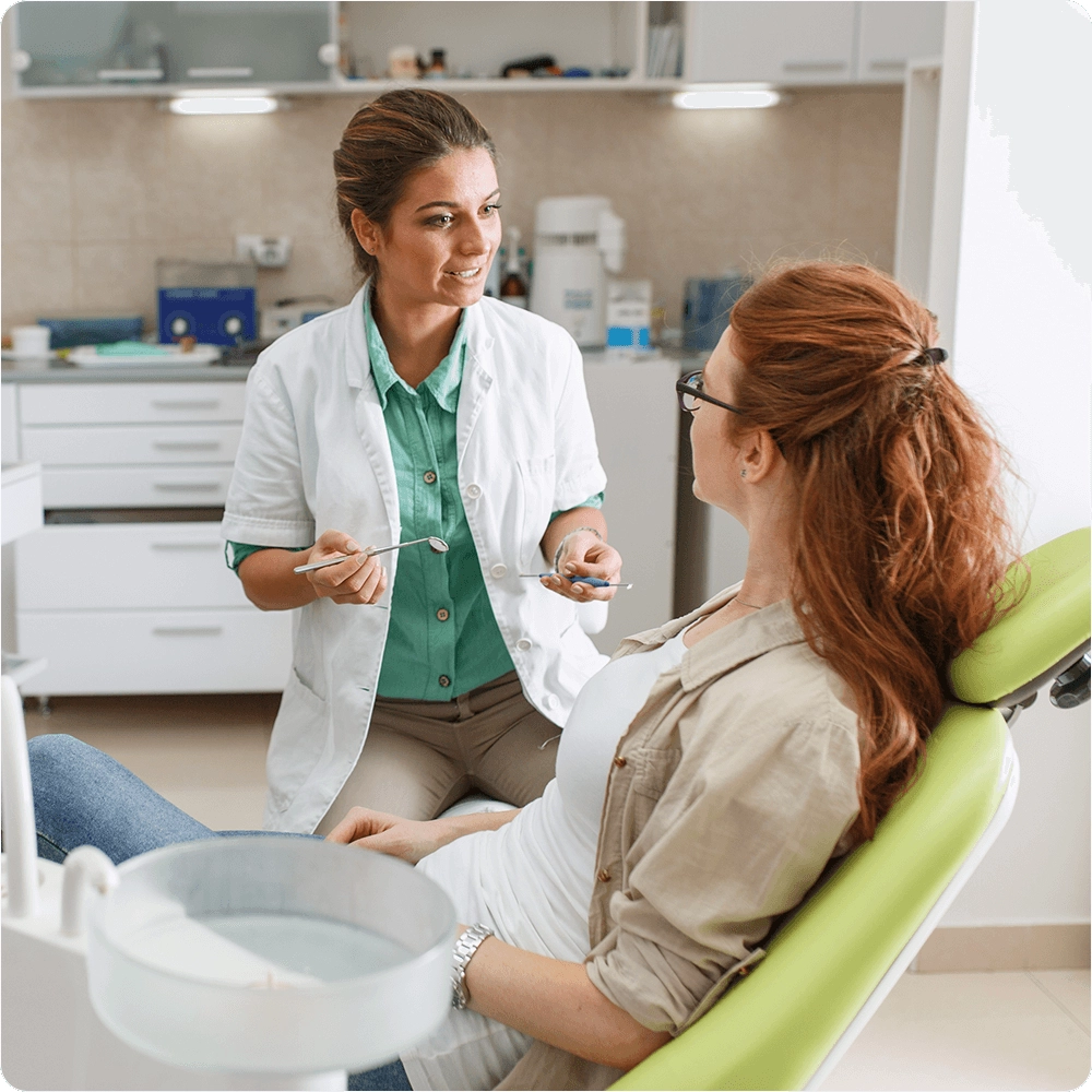 Dentist talking to patient