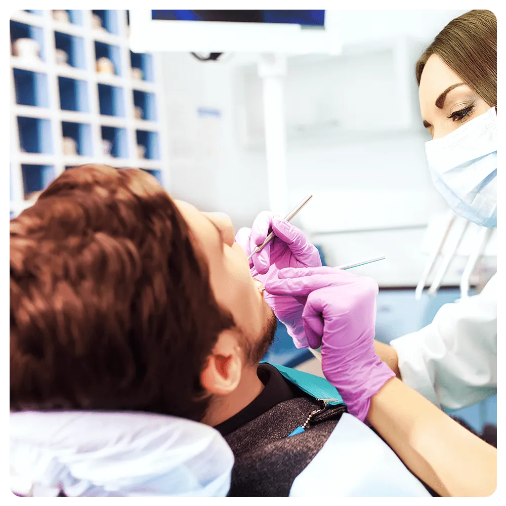 Dentist checking patient