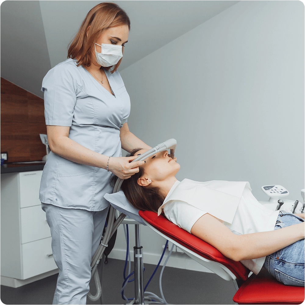 Dentist applying sedation Machine