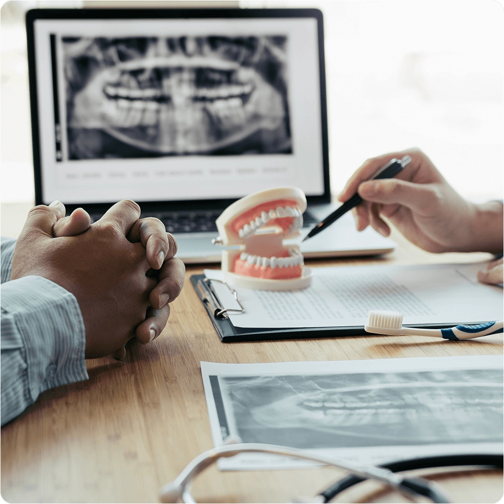 Dentist showing dental x-rays