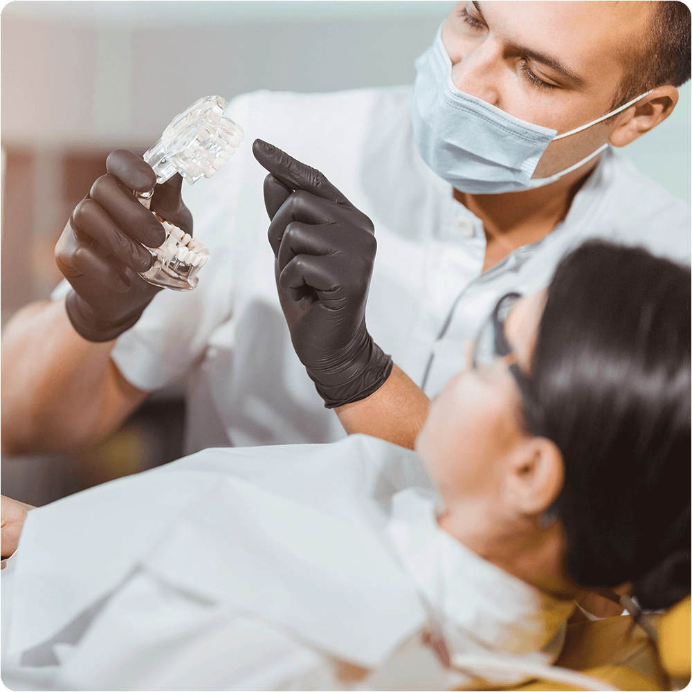 Dentist showing denture